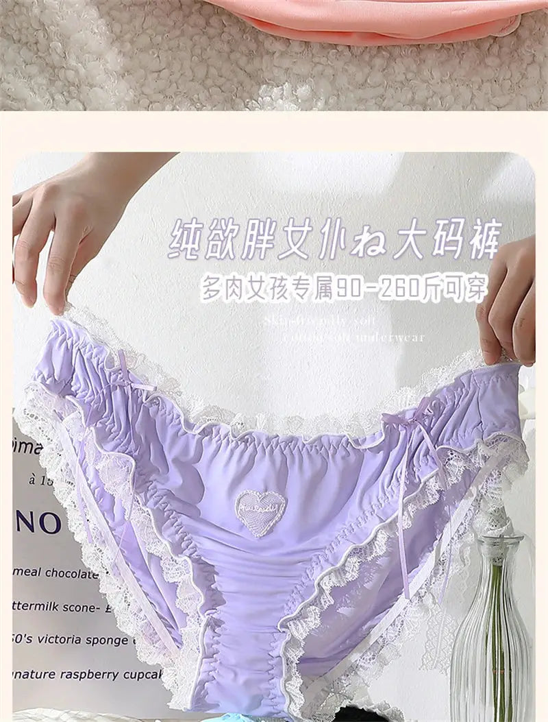 Lavender lace panties with white lace trim and heart emblem, women’s underwear