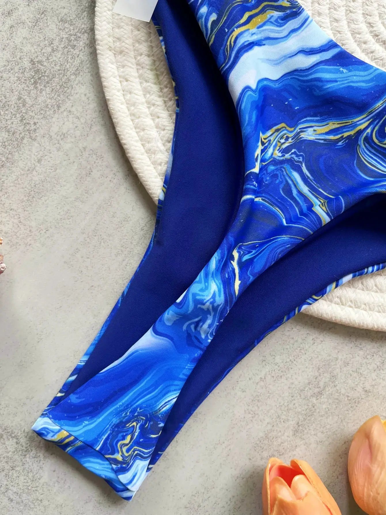 RUOTONSEPT print halter two-piece bikini set by Simples Market, blue marble pattern high-cut thong bottom.