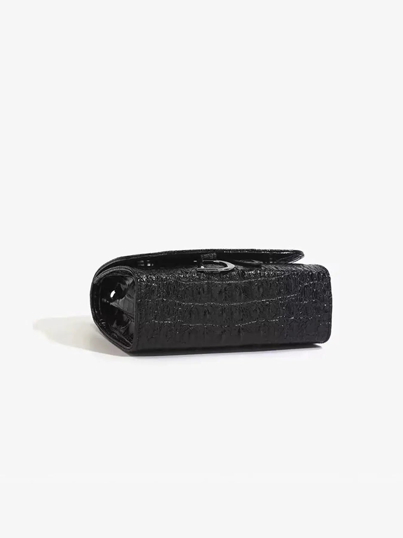 Women's black crocodile-embossed crossbody handbag with silver ring hardware