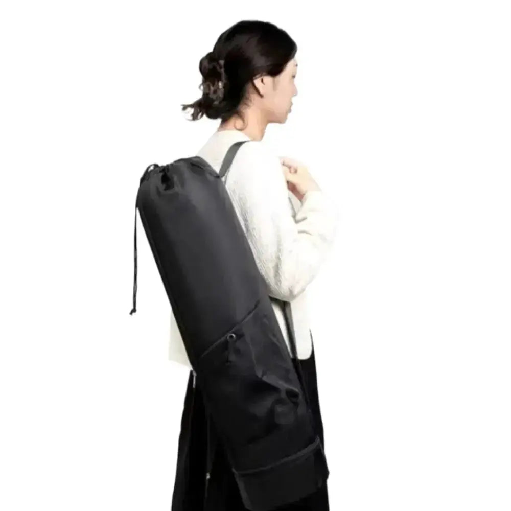Yoga mat backpack with large capacity, waterproof fabric, and adjustable shoulder straps in black.