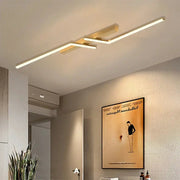 Modern LED ceiling light with gold finish and linear design for bedroom or living room