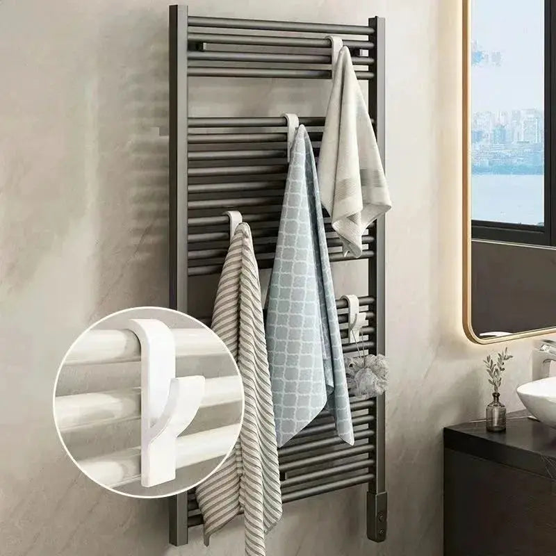 Wall-mounted bathroom towel radiator heater with dark gray horizontal bars
