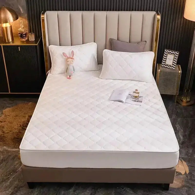 Queen-size plush thickened quilted white crystal velvet mattress cover fitted sheet on bed with two white pillows