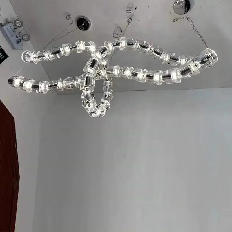 Chandelier ceiling light by Simples Market with multi-strand crystal acrylic beads and adjustable chain
