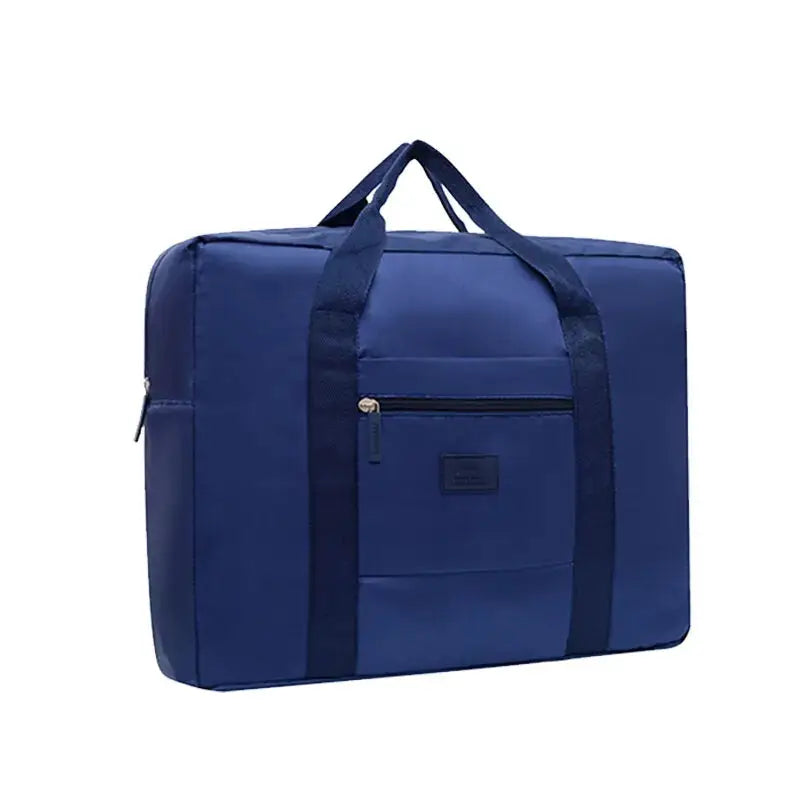 Foldable travel duffel bag by Simples Market in blue with front zip pocket and dual handles