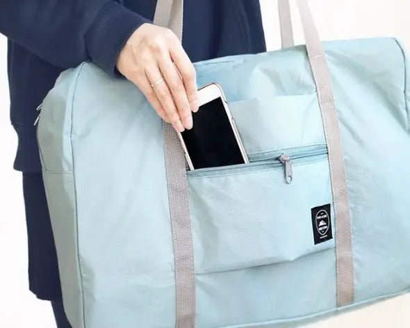 1pc large-capacity travel bag by Simples Market in light blue with beige handles and front zip pocket