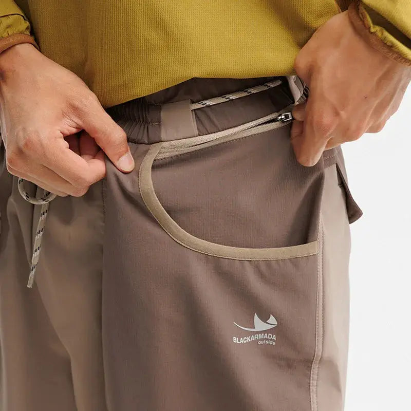 Men's outdoor lightweight cargo pants with tan trim pocket, drawstring waist, BlackArmada logo