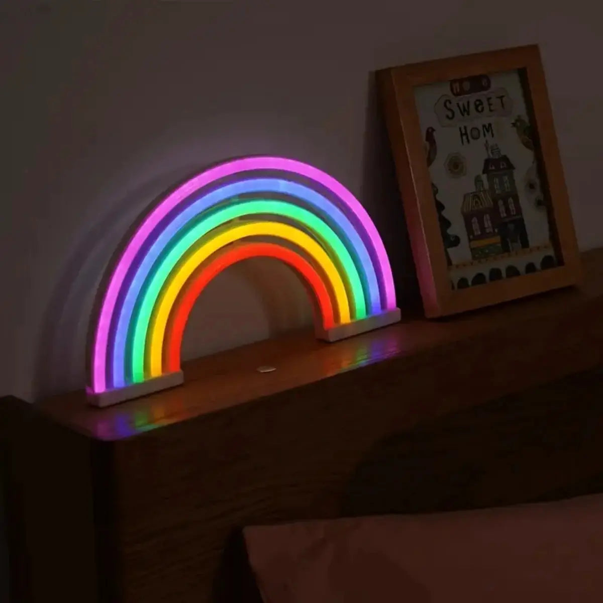Simples Market rainbow neon desk lamp with colorful LED glow on a wooden surface.