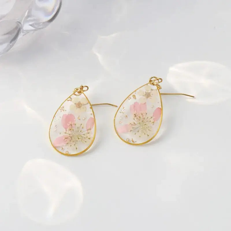 Simples Market pair of epoxy resin pressed flower teardrop earrings with pink petals and gold frame