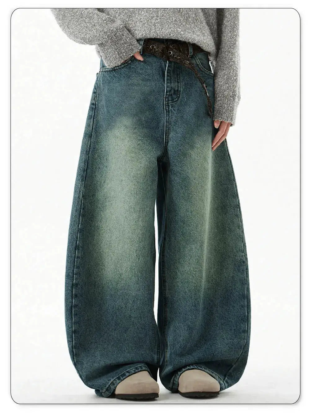 Men's blue wide-leg denim jeans with a loose, baggy fit and vintage faded wash