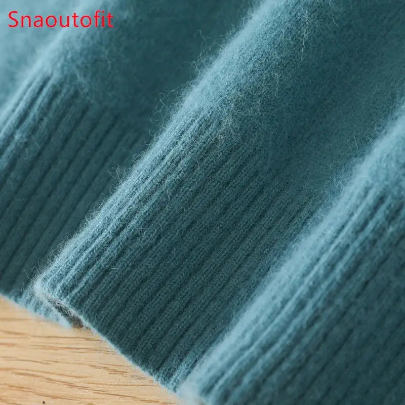 Men's mink cashmere sweater knit in teal with ribbed cuff close-up