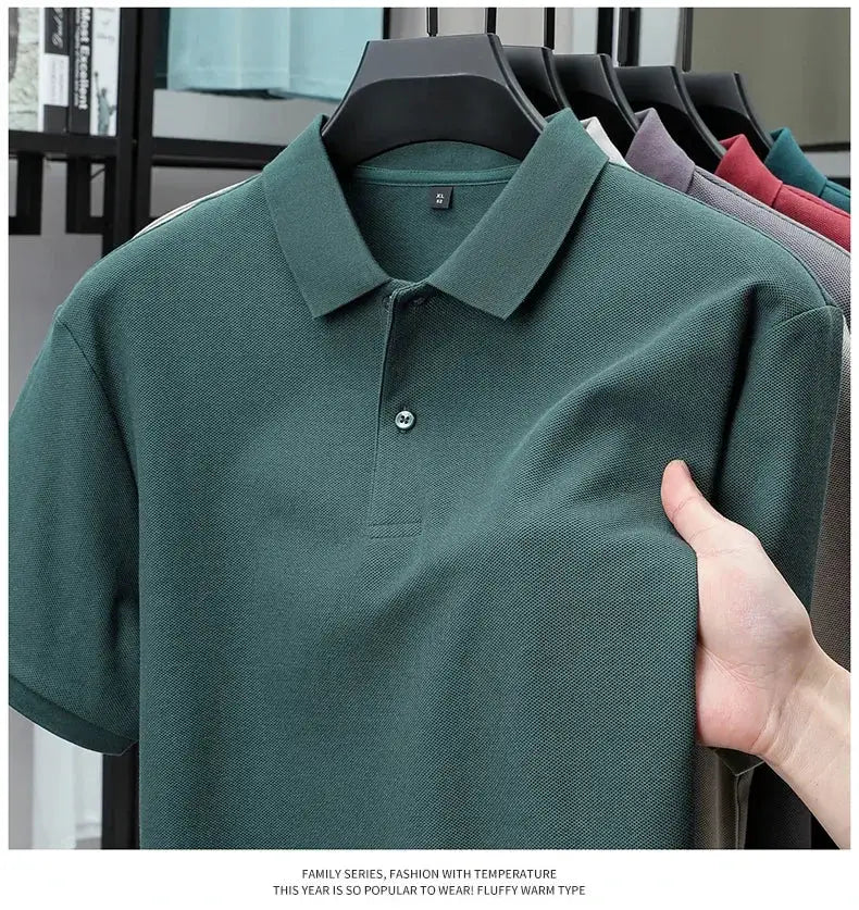 Men's 100% cotton polo shirt in teal, silk-like finish; polo collar on display with multiple colors.