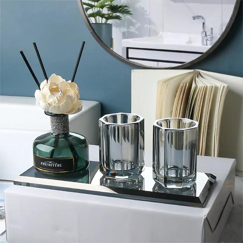 Simples Market glass bathroom set with green diffuser bottle, two clear crystal cups, and mirrored tray