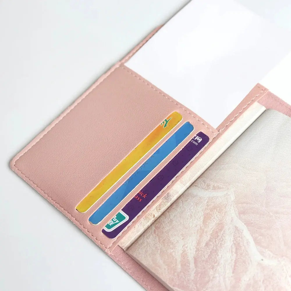 Pink leather travel passport cover set with card slots and passport holder; includes three colorful cards.