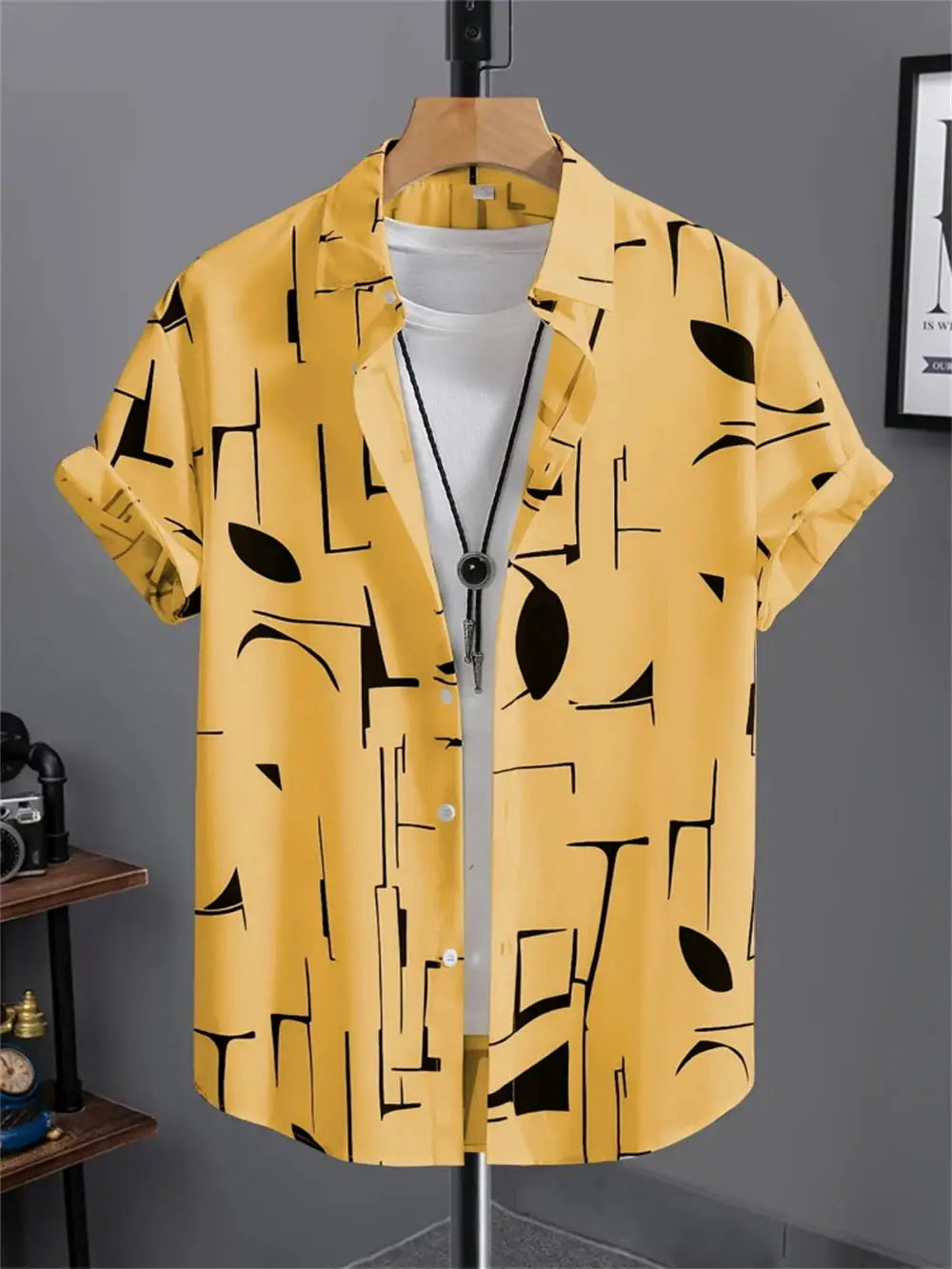 Yellow men's short-sleeve shirt with black abstract geometric print