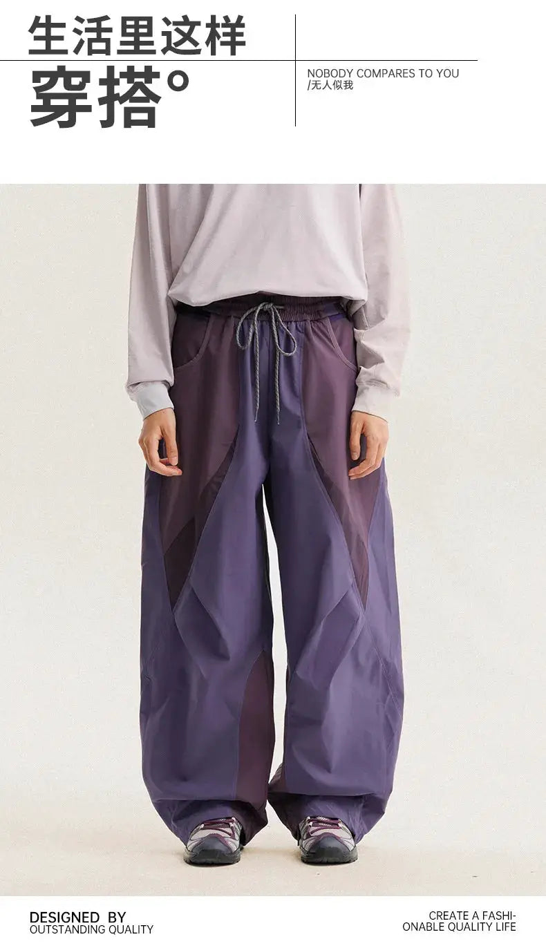Men's lightweight quick-dry cargo pants with purple splice panels, wide-leg silhouette, drawstring waist