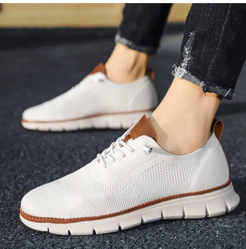 Men's white mesh casual sneakers with brown heel tab accents; lightweight and breathable