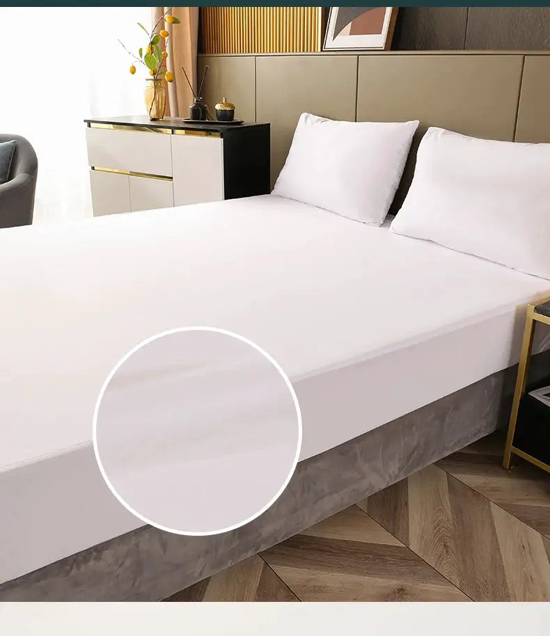 Simples Market waterproof mattress protector on a white fitted sheet bed; breathable noiseless jersey cover.