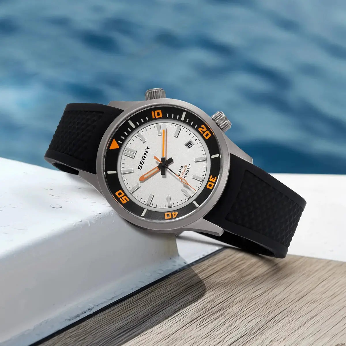 BERNY 20ATM titanium automatic diver watch on black rubber strap with white dial and orange accents.