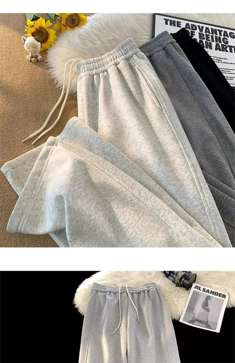 4 pairs of Simples Market heavy duty men's sweatpants in light gray, gray, charcoal, and black with drawstring waist