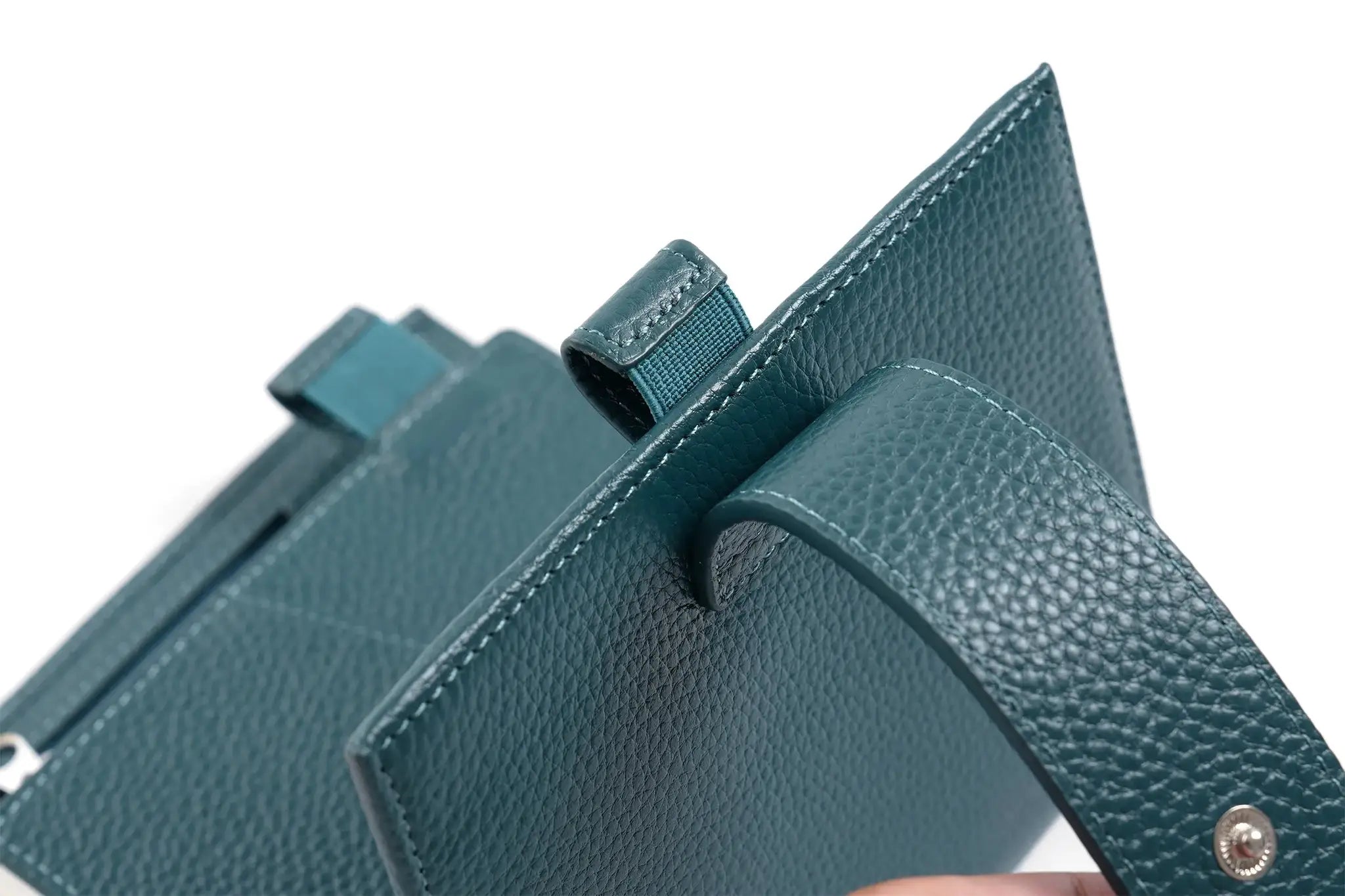 Moterm Luxe 2.0 pocket planner in teal pebbled leather with stitched edges and strap loop