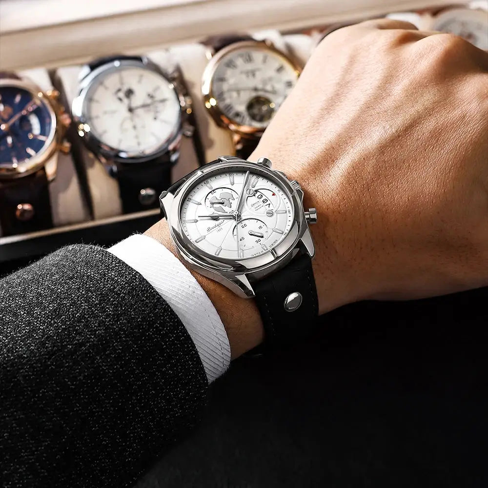 POEDAGAR luxury men's wristwatch with white dial and black leather strap; four other watches in the background.