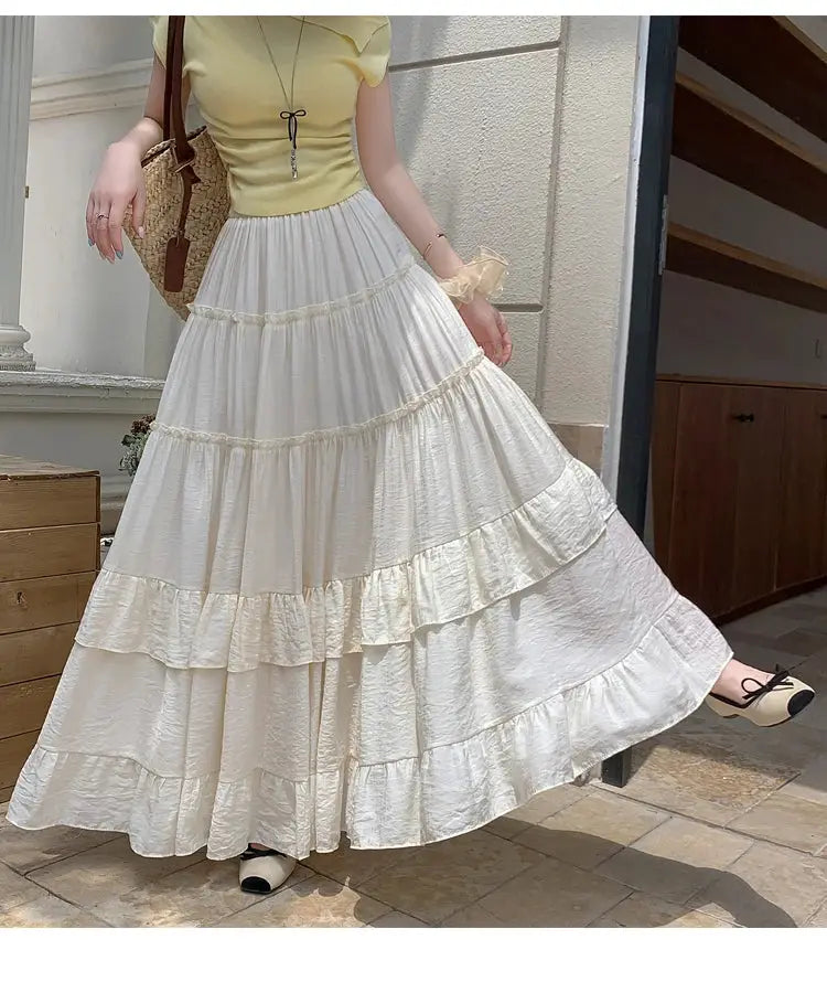 White tiered ruffle-hem chiffon maxi skirt, high-waist and flowy A-line by Simples Market.