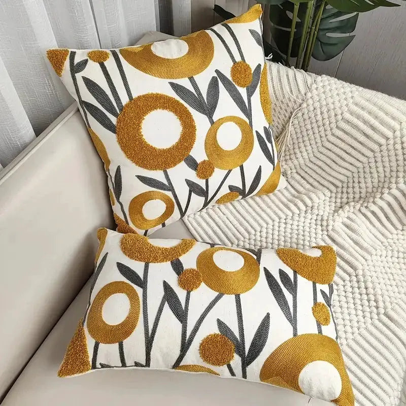 Boho floral tufted cotton pillow covers, 2-pack, with mustard yellow circles and gray stems on white.