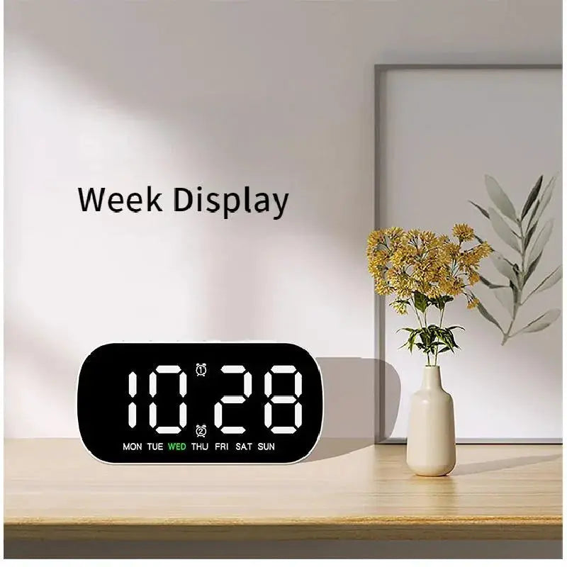 Digital LED alarm clock with USB power, 12/24h display and week indicator on a black rounded body