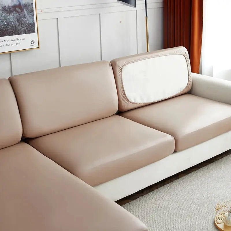 Sofa cover by Simples Market in beige; waterproof PU, elastic stretch for corner sectional