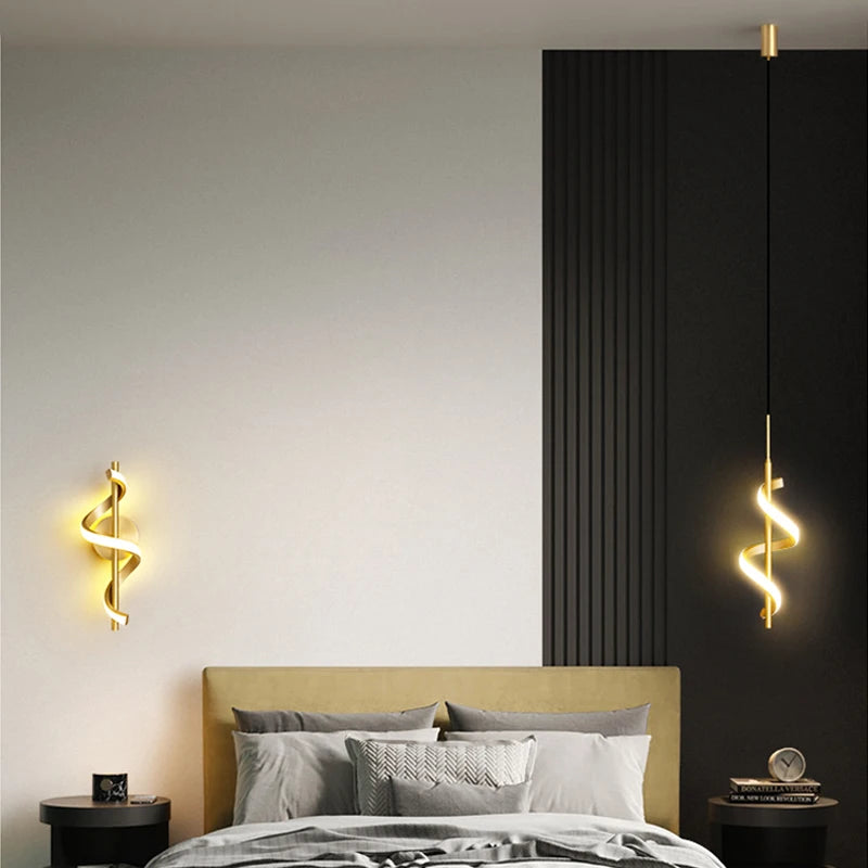Lustre LED spiral pendant lights in gold, two wall-mounted hanging lamps beside a bed in a modern bedroom.