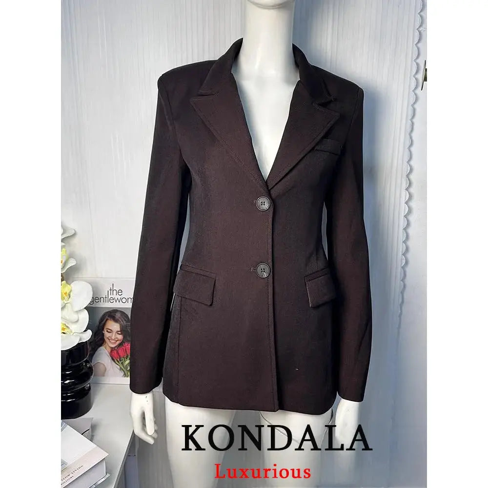 Kondala women's solid dark brown blazer with notched lapels, two-button front, and flap pockets.