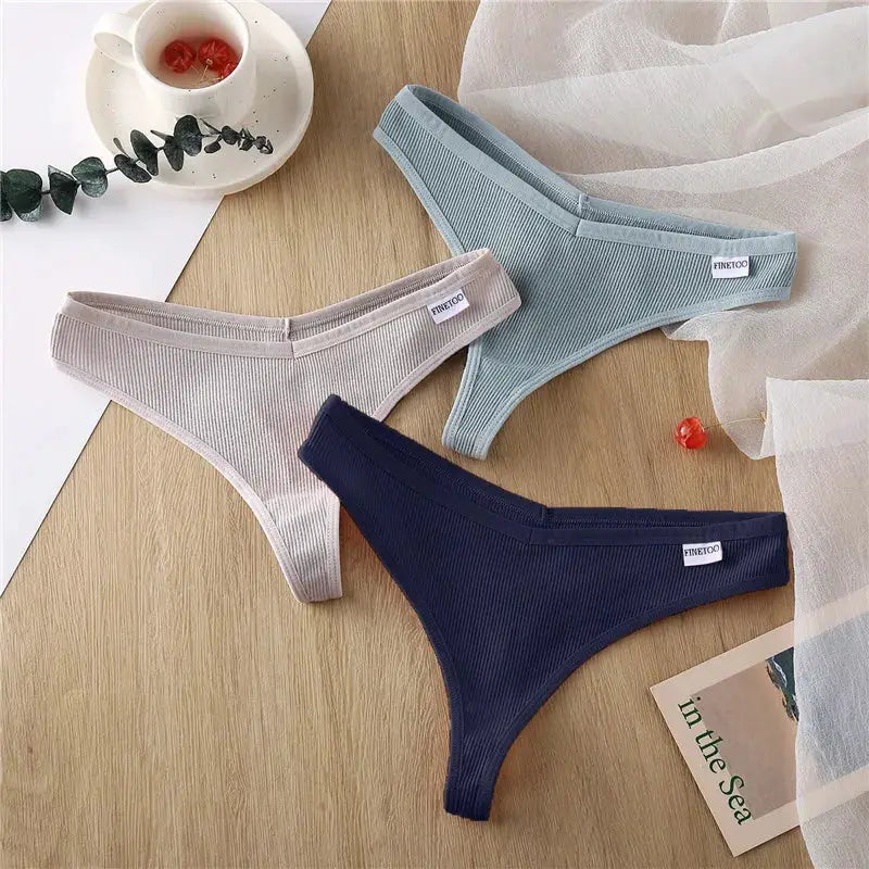 3-pack Simples Market women's cotton thong panties set in beige, light blue, navy; low-waist Brazilian style.