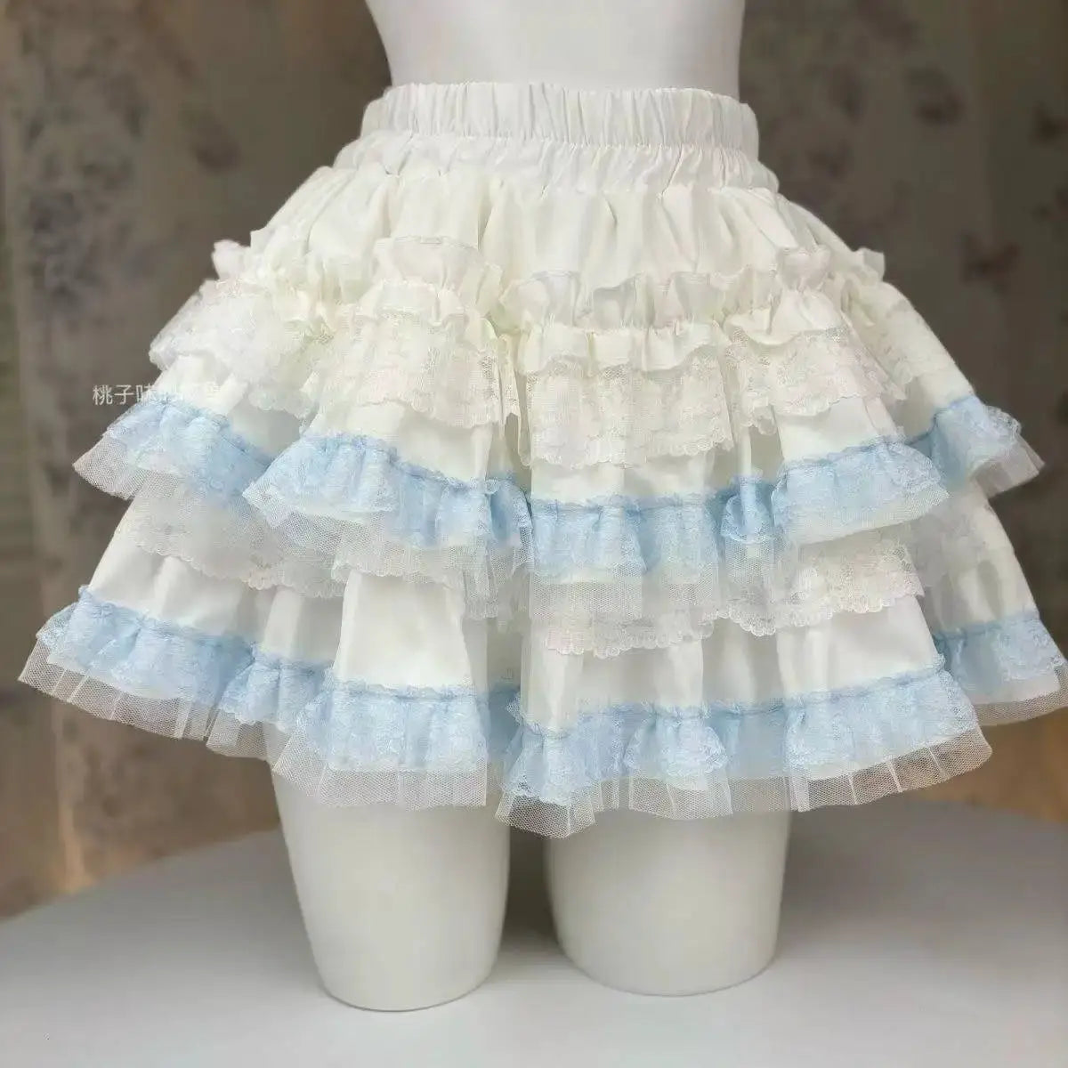 Simples Market Lolita style white tiered cake skirt with lace ruffles and light blue trim
