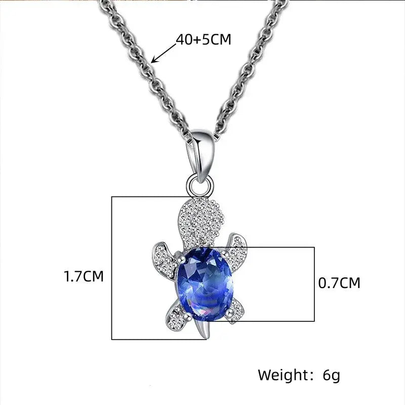 3pc turtle pendant jewelry set: silver-plated necklace and earrings with a blue oval glass gemstone and clear crystals