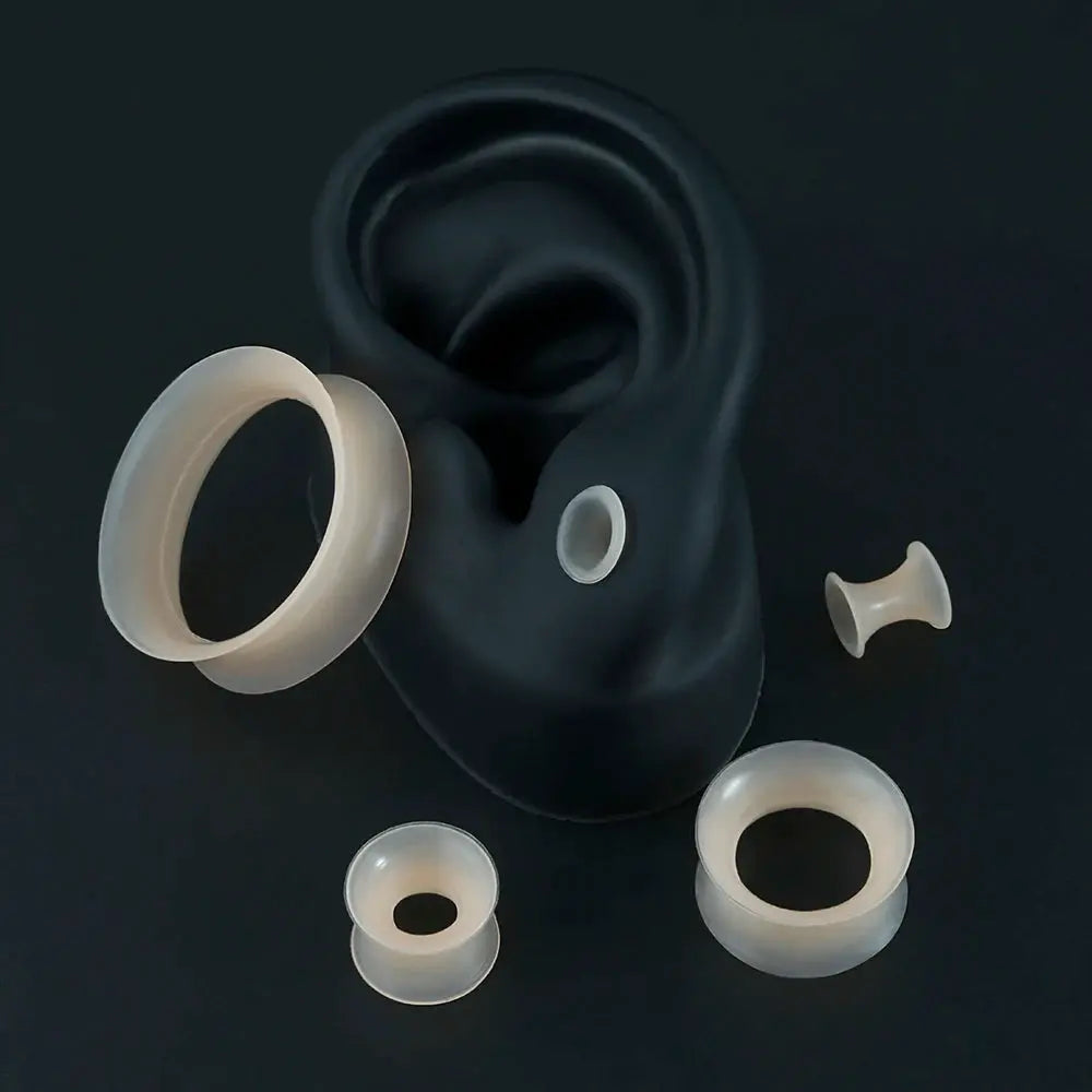 Set of six skin-tone silicone ear tunnels for stretched ears with double-flare flesh tunnels