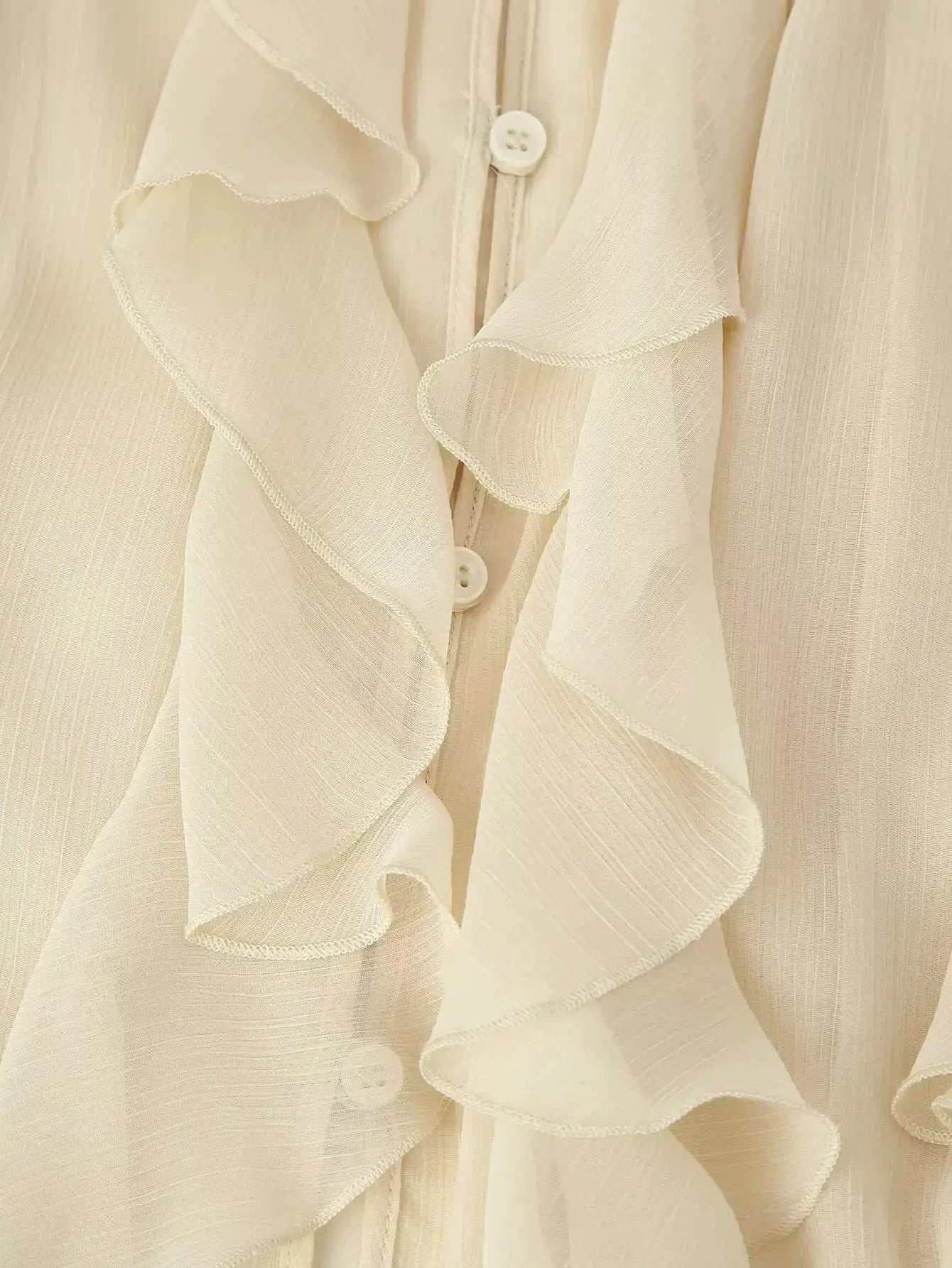 YENKYE sheer ruffle blouse with front button placket, long sleeves in cream
