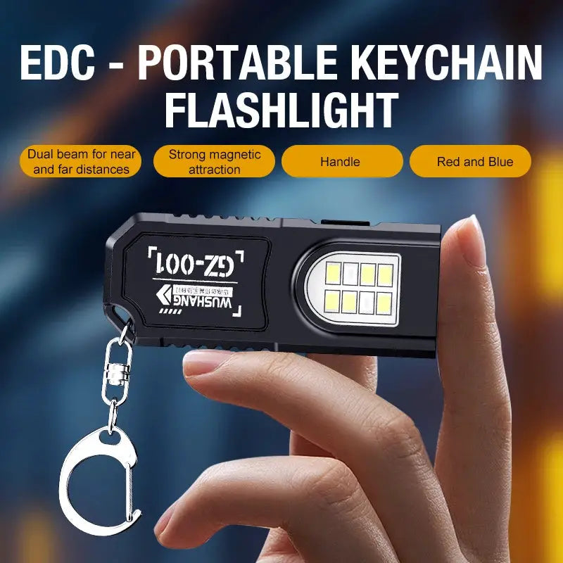 Portable keychain flashlight by Simples Market with LED panel, black metal body and carabiner.