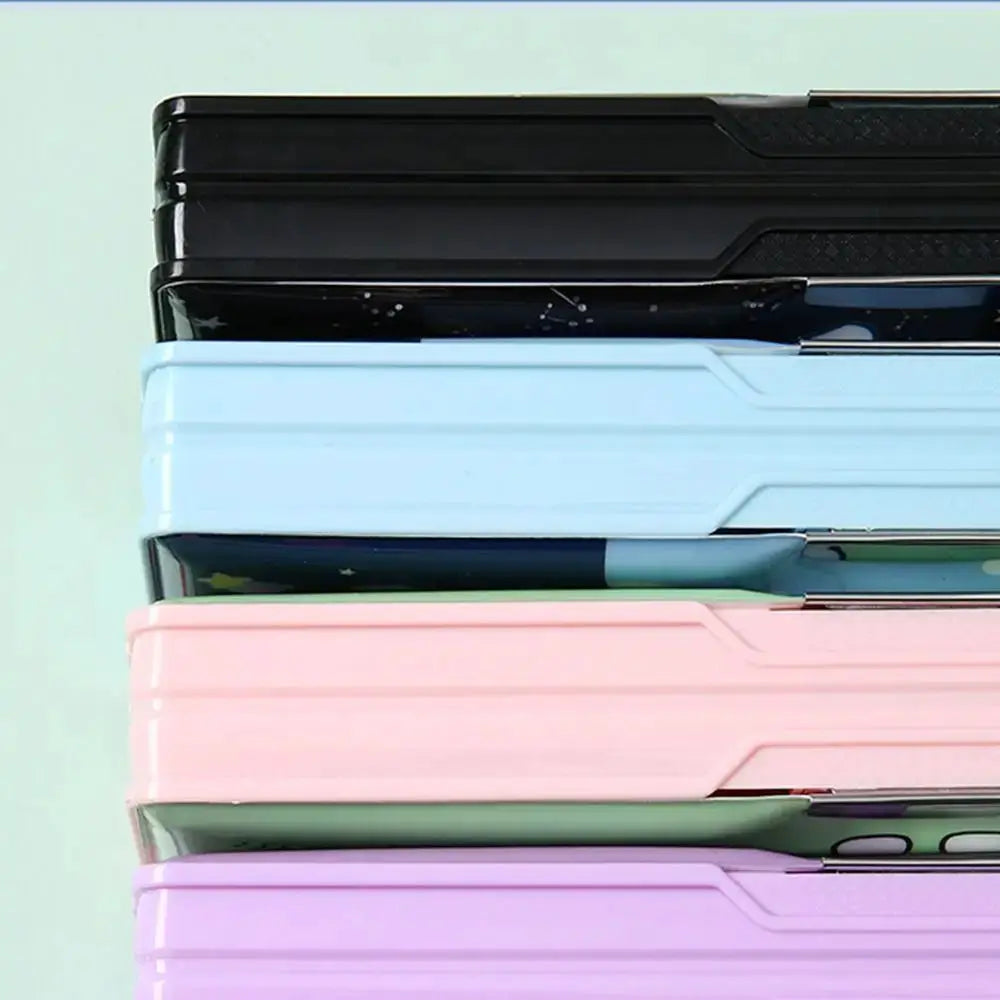 Double-layer plastic pencil cases, five stacked in black, light blue, pink, green and lavender.