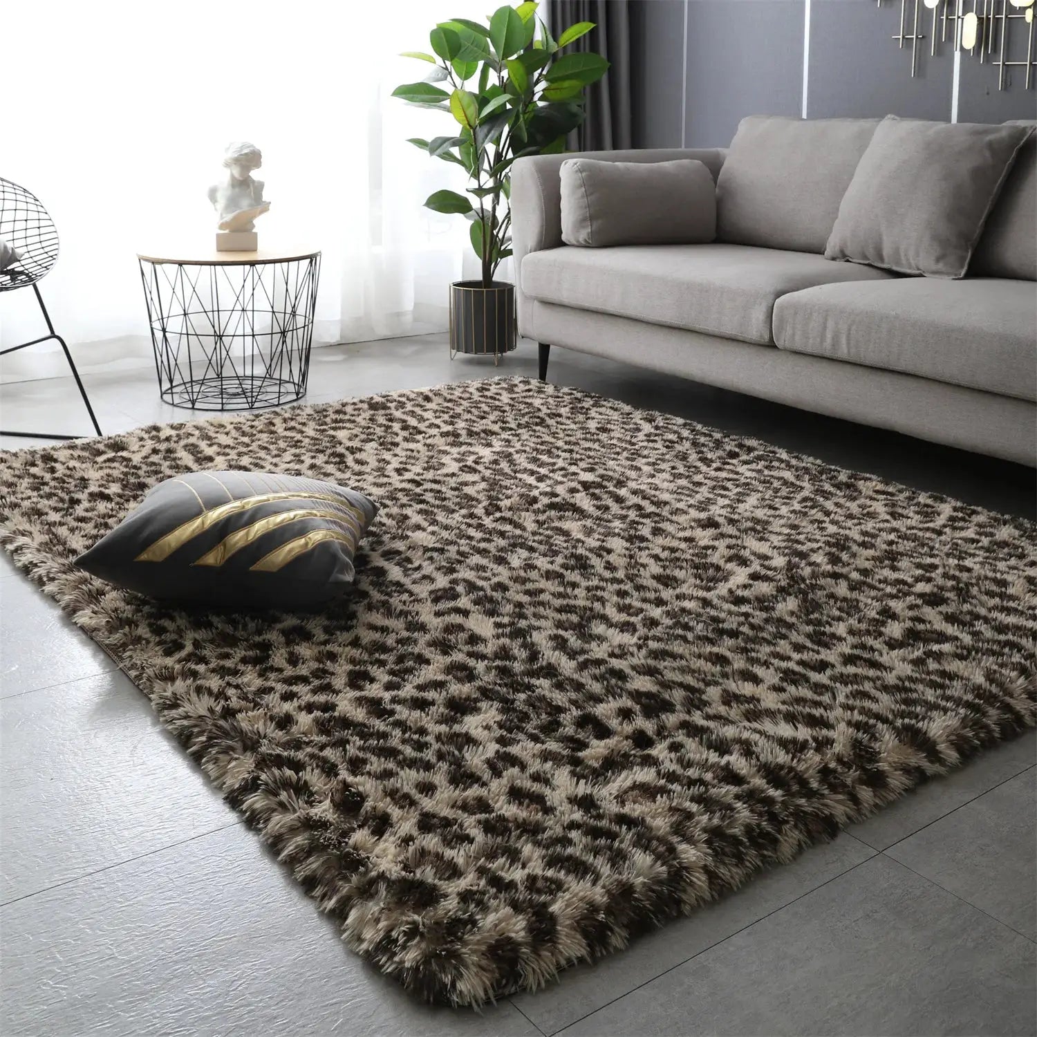 Fluffy shag rug with brown leopard print in a modern living room beside a gray sofa.