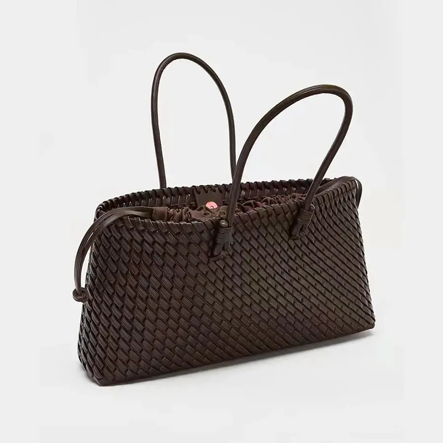 Simples Market brown woven tote bag with dual handles.