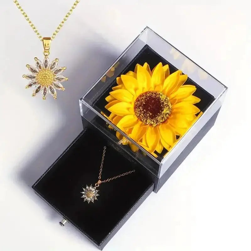 Sunflower pendant necklace in gold-tone with yellow petals, displayed in clear gift box by Simples Market