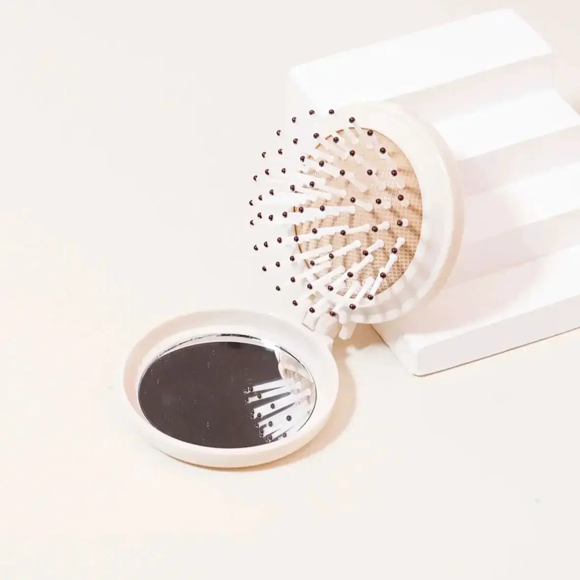 Mini folding hair brush with mirror, white plastic, anti-static, travel accessory for wigs