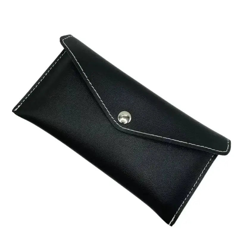 Unisex long black leather wallet with snap closure and white stitching, by Simples Market.
