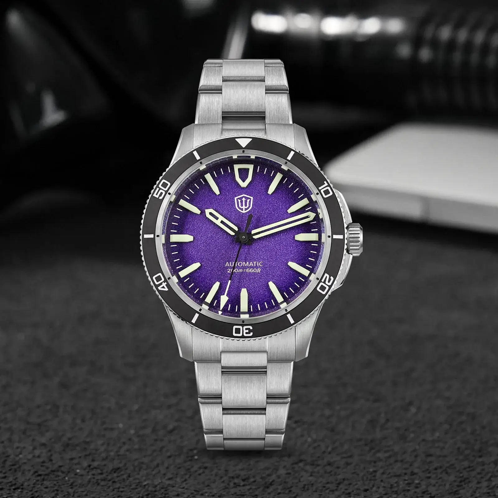 Watchdives Premier 39mm automatic watch with purple dial, ceramic bezel, stainless steel bracelet.