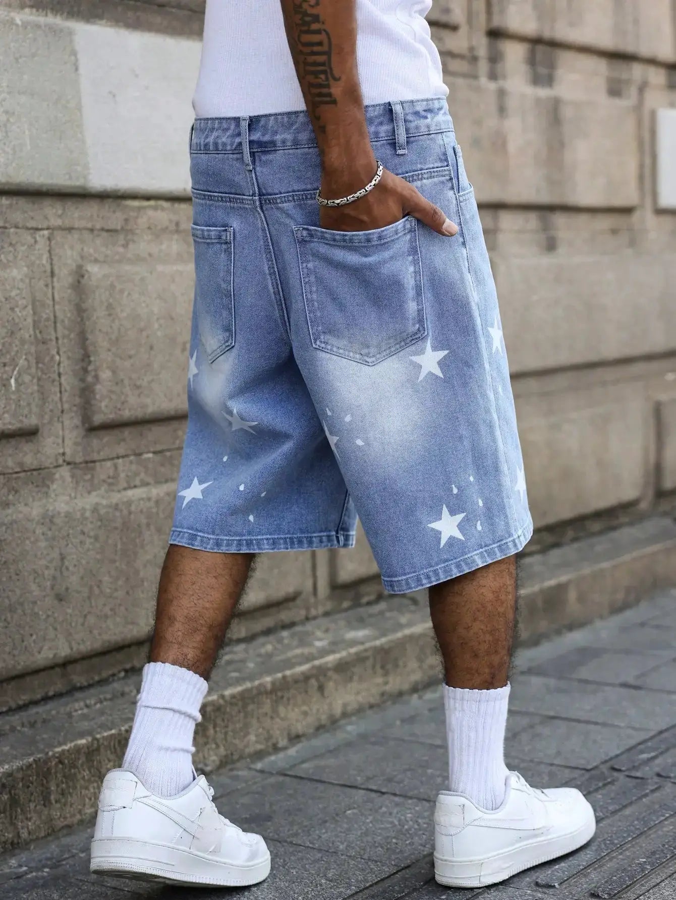 Men's blue denim shorts with star prints on the legs by Simples Market