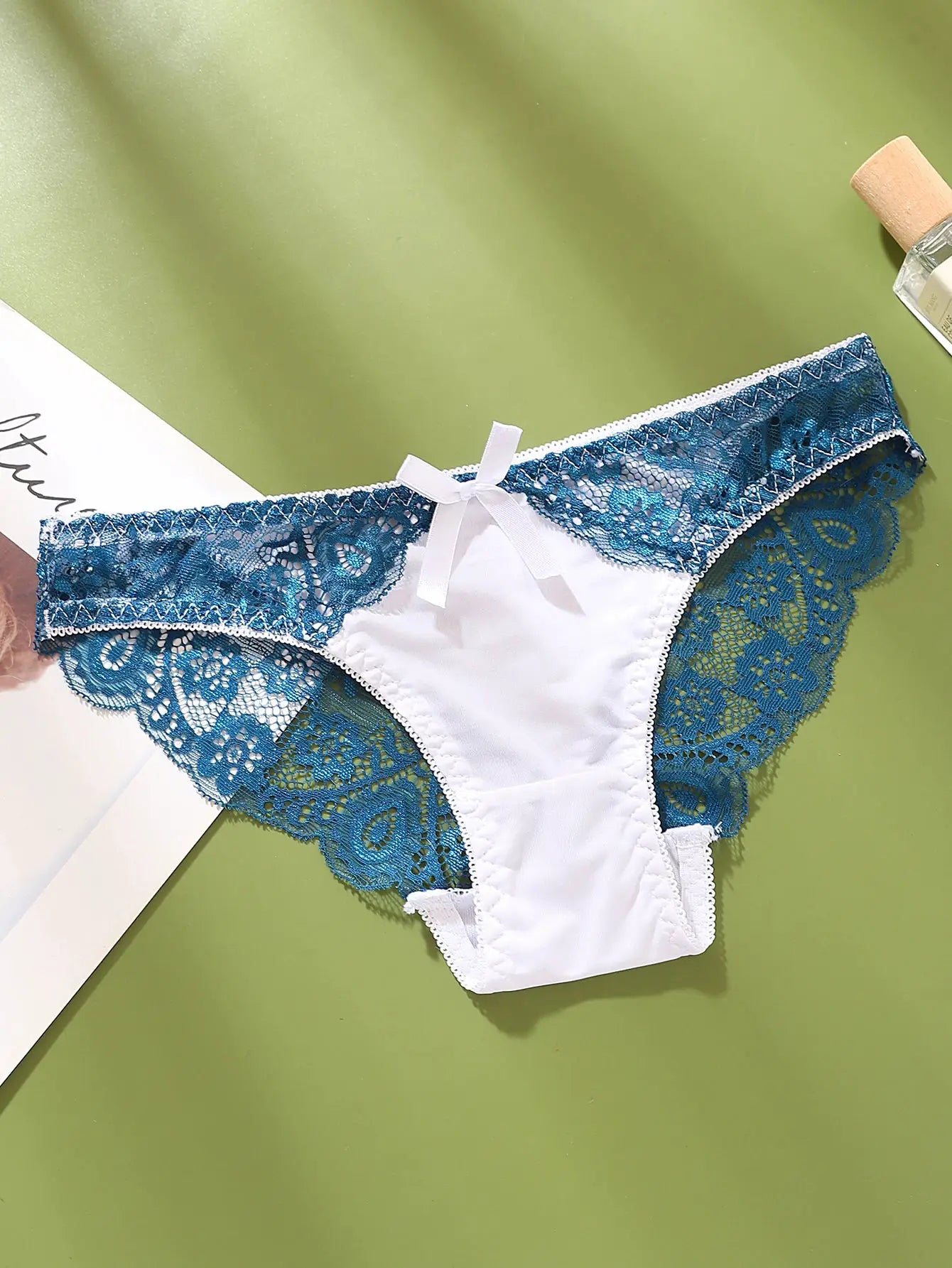 Simples Market lace color-block panties, teal blue lace with white satin panel and bow, mid-low rise