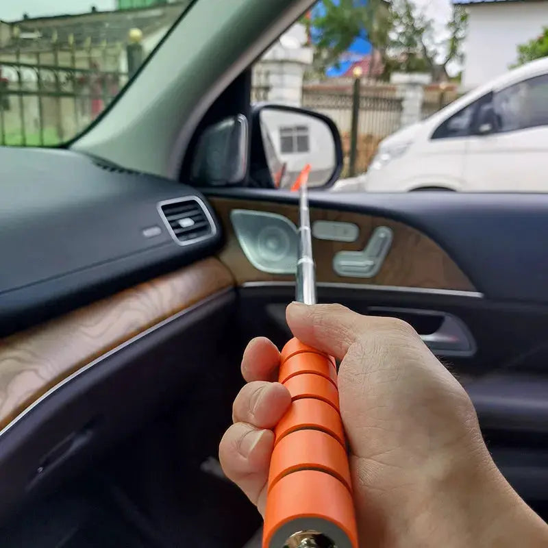 Car rearview mirror cleaning tool with orange grip handle and metal scraper tip