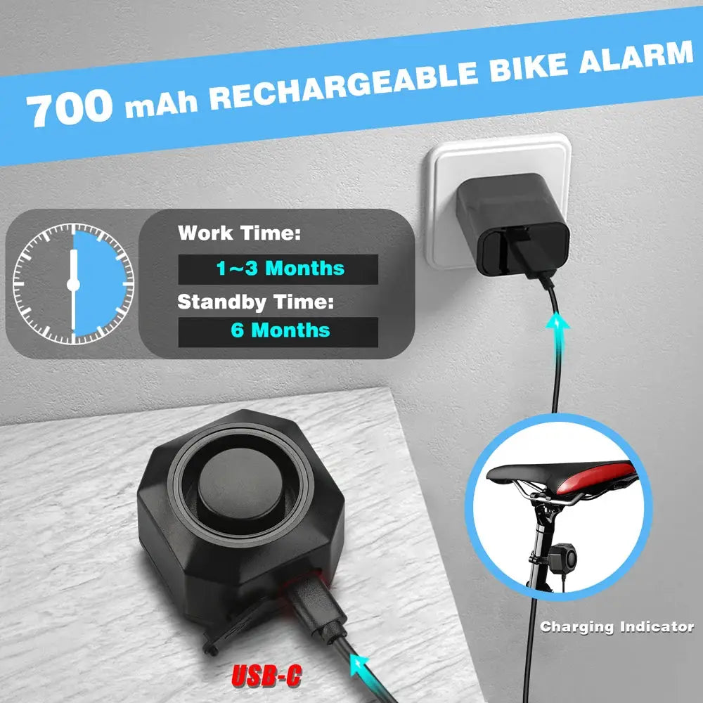 Hollarm wireless bike alarm; black hexagonal unit with USB-C charging cable and saddle charging indicator