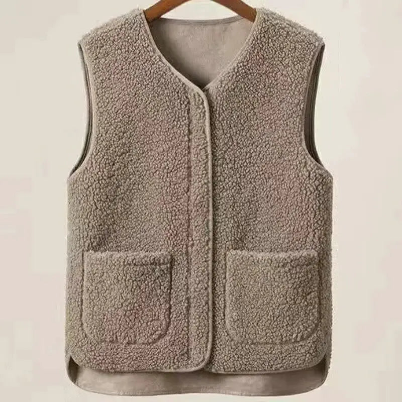 Lamb fleece men's vest in taupe, sleeveless with zip-front and two front pockets.